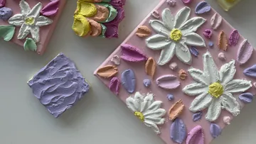 Colorful paintings with daisy flowers on canvas.