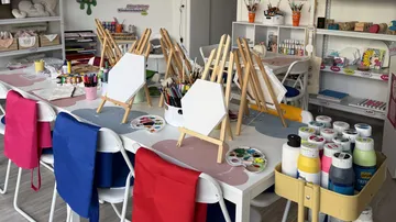 Art studio with easels and supplies.
