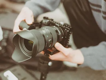 The camera is held in the hand by a person.