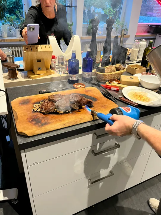 Steak on board torched in kitchen