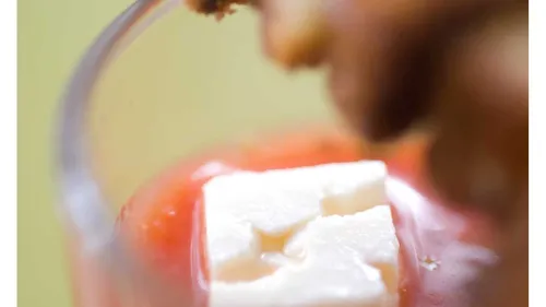 Tofu cubes in spicy sauce, close-up view.