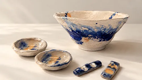Ceramic dishes and bowl on table.