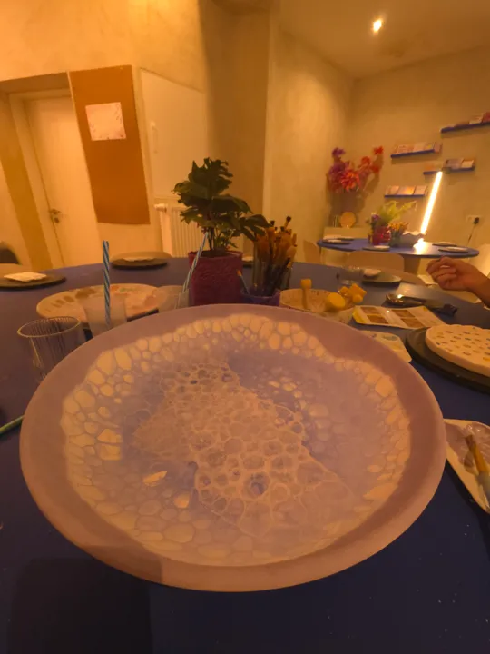 Plate with bubble patterns on a table.