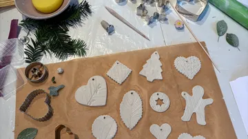 Clay ornaments being crafted on a table.