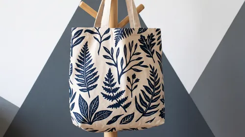 Canvas tote with plant prints hanging.