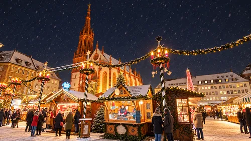 Festive market stalls with church background.