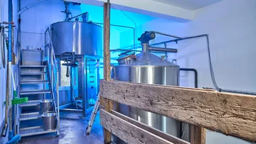Large metal tanks in a modern brewery.