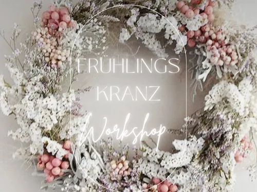 Spring wreath surrounded by dried flowers, advertised for workshop.