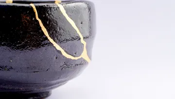 Ceramic bowl repaired with gold cracks.