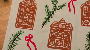 Gingerbread houses with pine and ribbons motif.