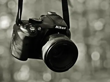 Camera hangs and waits for a photo in nature.