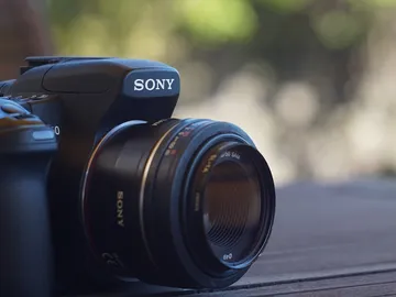Camera on wooden surface focused in natural light