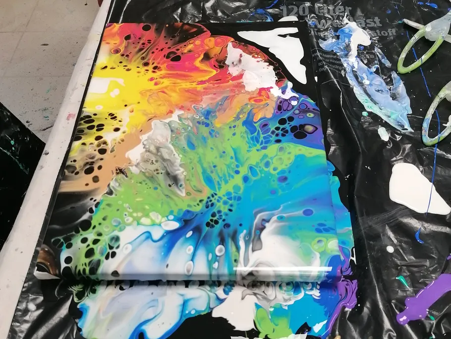Colourful color painting on canvas, in a creative workshop.