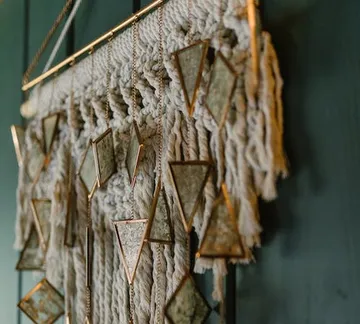 Macrame wall hanging and adorns the room.