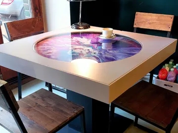 Art machine integrated in the dining table