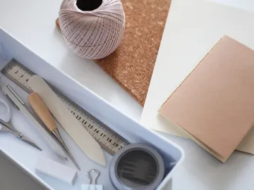 Tools and materials are neatly stored in a box.
