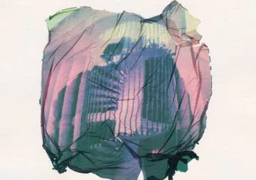 Colorful, crumpled paper shows blurry, geometric shapes.