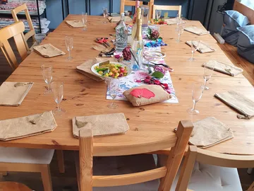 A set table with food and glasses.