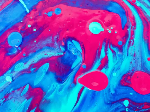 Colorful swirls of color with blue and red dots in the background.