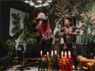 People dancing in a tastefully decorated room.