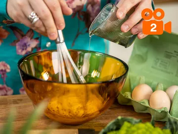 The bowl is filled with oil while eggs are lying next to it.