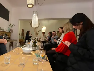 Group of people having a round of conversation in a bar.