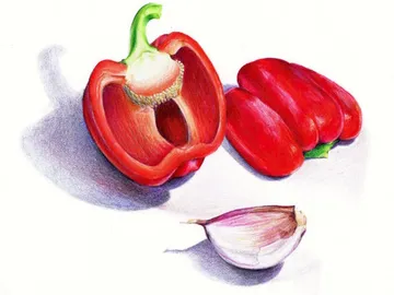 Red pepper and garlic are on a table.