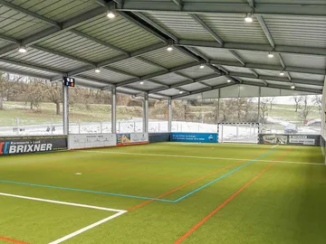 Indoor soccer field, ready for the game, with artificial turf.