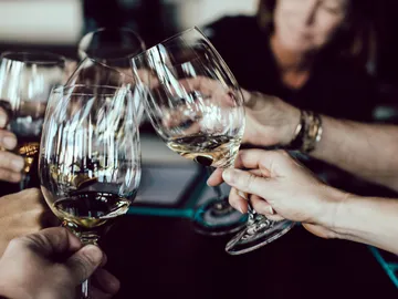 Glasses toast to celebrate a special moment.