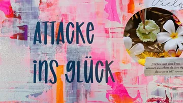 Bunte Wandgestaltung mit dem Text „Attacke ins Glück“.