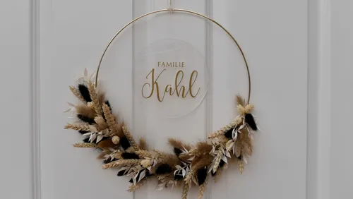 A decorative wreath hangs to greet a family
