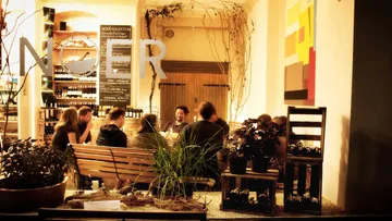 Group sitting at table enjoying drinks in a restaurant.