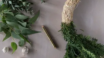 Green vegetables and decorative elements on a table.