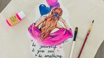A woman with long hair looks at colorful balloons.