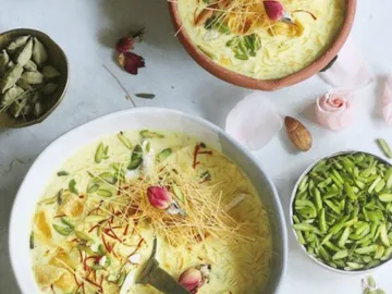 Bowls of sweet milk dish surrounded by ingredients.