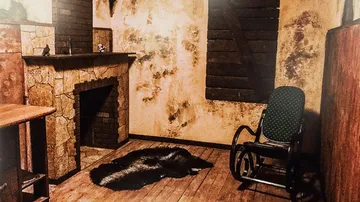 Chair stands next to the fireplace in a dilapidated room.
