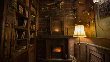 A warm fireplace is burning in a comfortably furnished room.