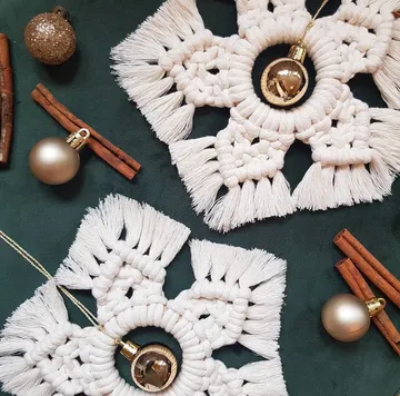 Bright macrame coasters with Christmas tree decorations and cinnamon sticks