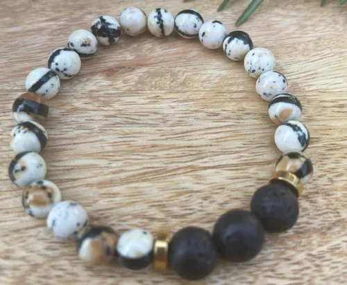 Colourful pearl bracelet sits on a wooden surface