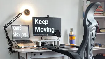 Desk with computer and chair, encourages activity