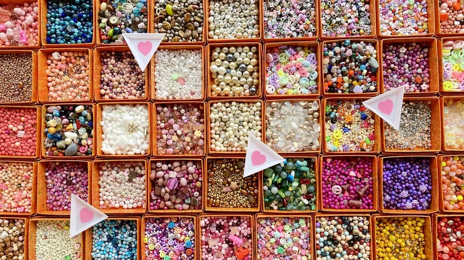 Colourful beads in boxes, organized and ready for craft activities