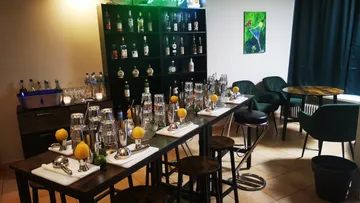 Bar with glasses and shakers ready for cocktails.