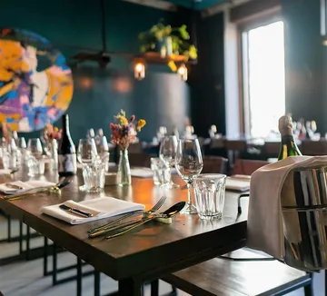 Elegantly set restaurant table with glasses.