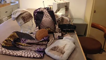 Colourful accessories lie on a table in the studio.