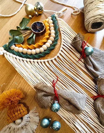 Colourful craft materials lie on a wooden surface.