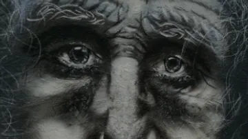 Old, frightened facial expression with deep, expressive eyes.