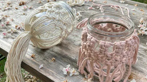 Two decorated glasses lie on a wooden table.