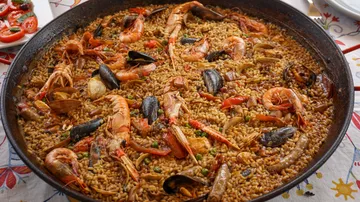 A seafood paella is served.
