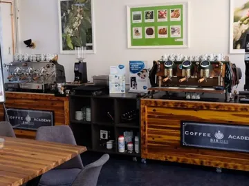 Coffee counters with machines in a cozy space.