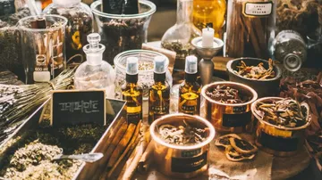 Spices and oils are arranged on a table.